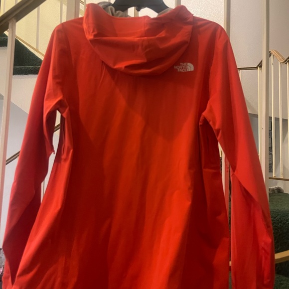 A orange north face jacket - Picture 3 of 4